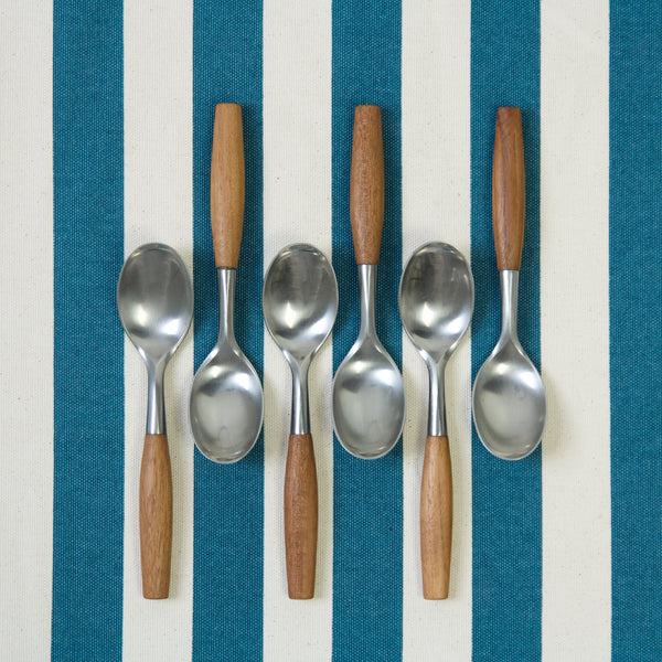 6 teaspoons arranged top and tail. The spoons that are perfect for desserts were designed by Danish sculptor Jens Quistgaard in 1953. This set made in Germany by Dansk Designs.
