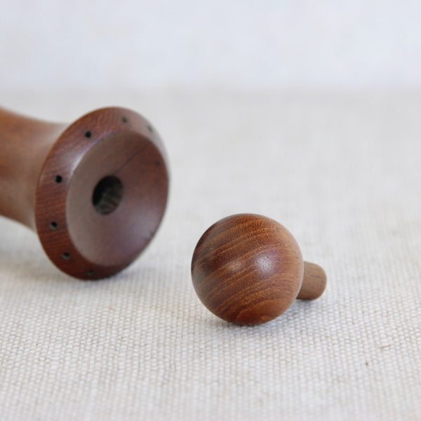Close up of baller stopper belonging to a vintage mid-century Nordic pepper mill model 879 by Jens Quistgaard Dansk Designs collectible.