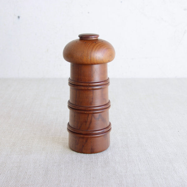 Top down shot of a vintage mid-century Jens Quistgaard Model 892 pepper mill in teak for Dansk Designs