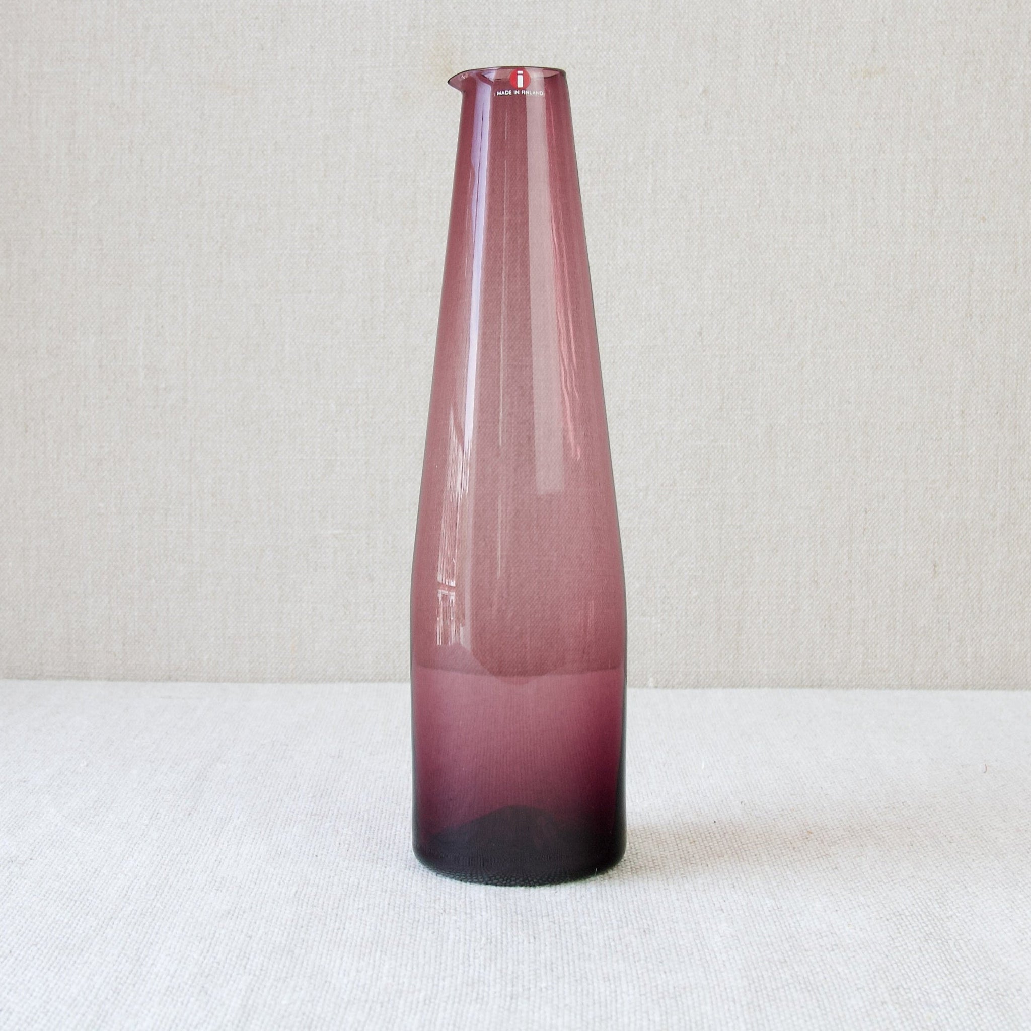 Timo Sarpaneva's 1956 deep plum purple coloured glass carafe or pitcher for Iittala, a very elegant Nordic design