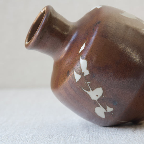 Wax resist decoration method and Japanese kaki glaze on Jim Malone British studio pottery vase 