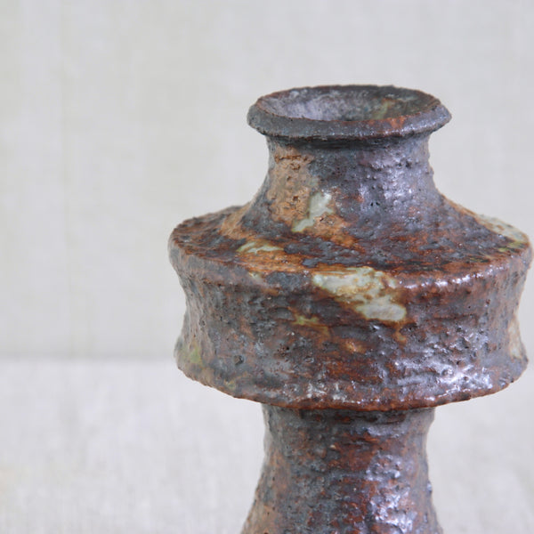 Glaze detail on UFO-like vase by Annikki Hovisaari for Arabia Finland, with an architectural silhouette in coarse chamotte clay.