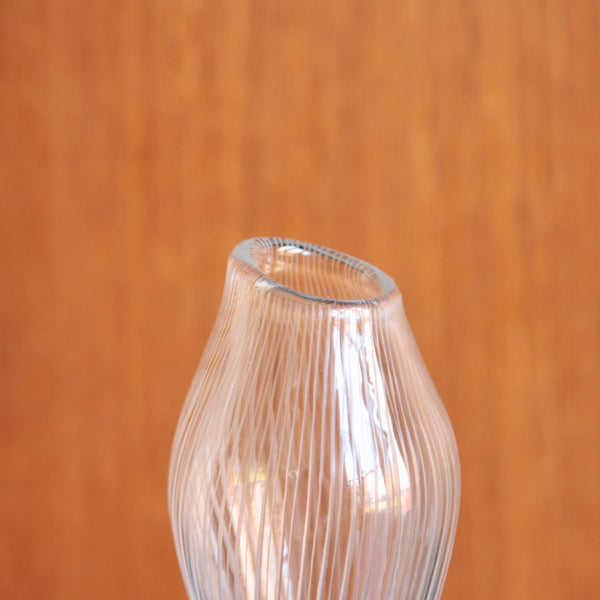 Zoomed in image of the top half of a 1950s Iittala clear glass vase by Tapio Wirkkala, Varsanjalka design inspired by coltsfoot.