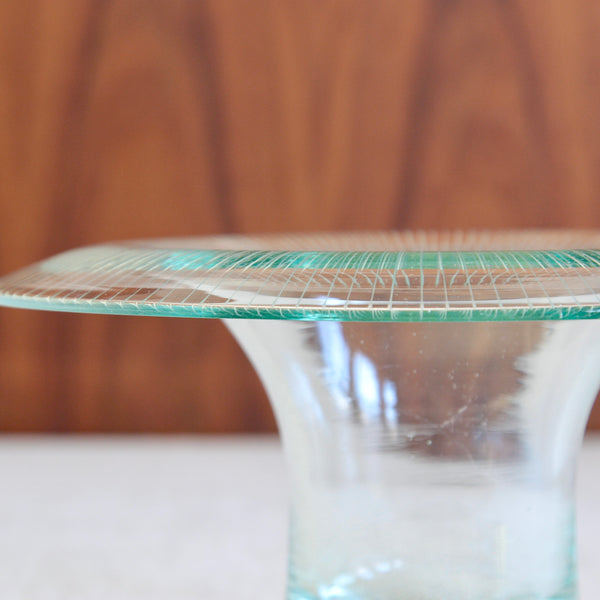 Close up of the incised cut glass rim or collar on a Helena Tynell Kaulus bowl in clear bluish glass early Finnish Modernist design admired by Asian collectors of vintage Nordic works