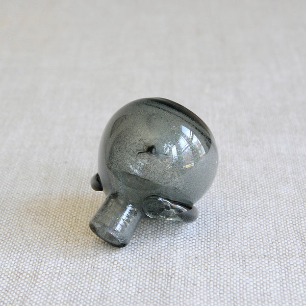 Top down view detailing manufacturing flaw on an early Boda glass vessel designed by Erik Höglund, demonstrating his first explorations of the human silhouette in blown glass.
