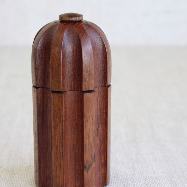 Detail of fluting on body of a Scandinavian modernist pepper mill by Jens Quistgaard for Dansk Designs.