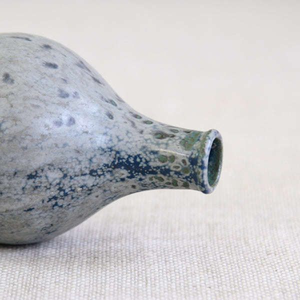Close-up of Arne Bang stoneware bottle showing detailed dappled glaze. A classic Scandinavian Modernist design.