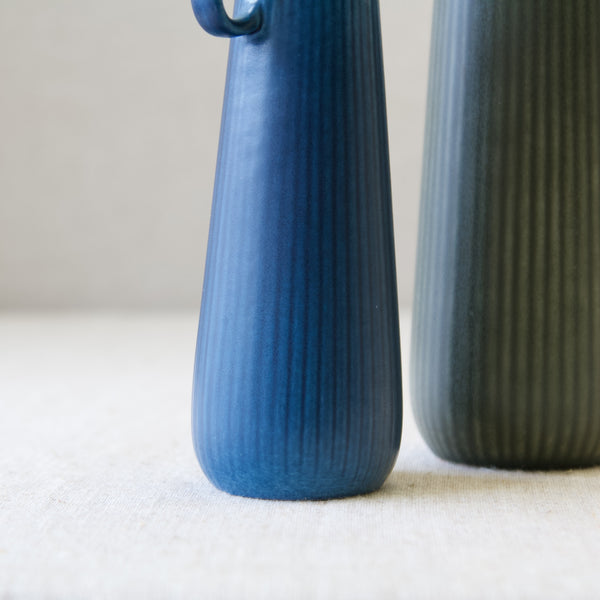 Ribbed underglaze texture on pair of Ritzi ceramic vases designed by Gunnar Nylund for Rörstrand