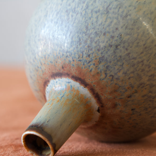 Detail of green, grey and copper haresfur glaze on vintage Rorstrand vase