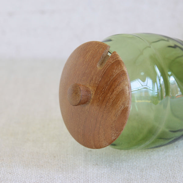 Detail of lid on a Mid-century Scandinavian storage jar by Erik Höglund for Boda, featuring a barrel shape in solid pine with an inset hand-blown glass container.