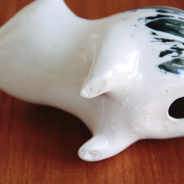 Detail of the underside of a foot on a large Modernist bear sculpture, beautifully hand-painted and richly characterful, by Susan Parkinson. The foot is stamped with a makers mark.