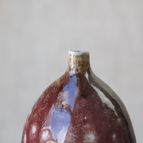 Detail of Guy Sydenham oxblood vase with narrow neck and oval form