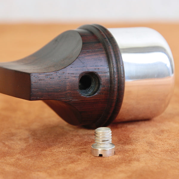 Close up of filling hole on the side of a rare Rosewood & Silver series pepper mill by Dansk Designs, created by renowned designer Jens Quistgaard.