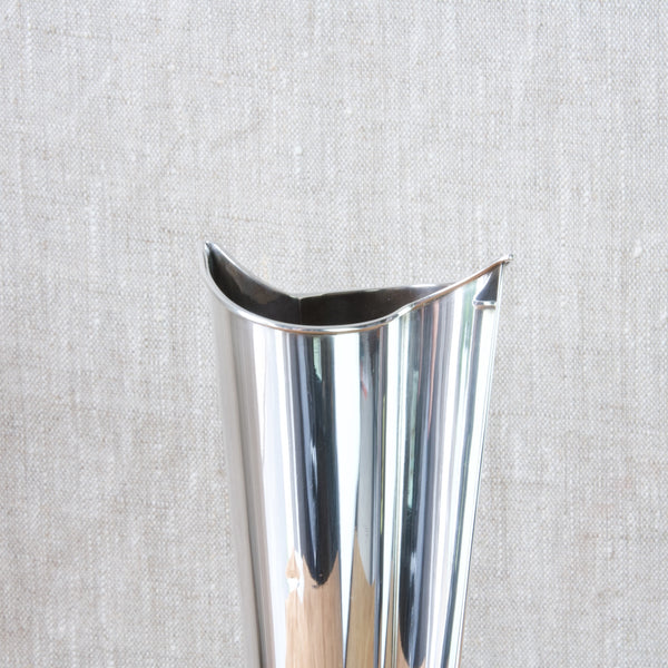 Zoomed in image showing the mouth of a silver vase designed by Tapio Wirkkala. Wirkkala's works in silver were inspired by nature but are also abstracted.