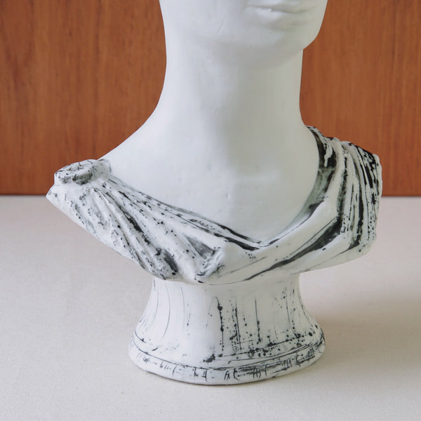 White ceramic bust with black accents on a plain background. A finely modelled Modernist bust of a Greek gentleman by Susan Parkinson, rendered with painterly confidence and simplicity.