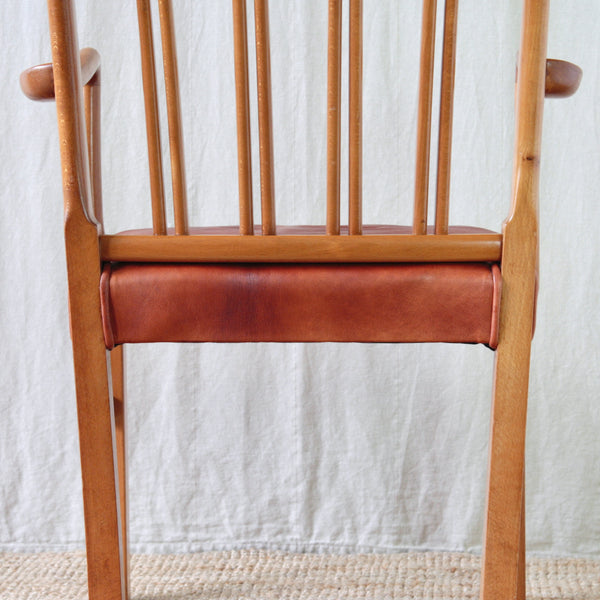 Close view of the paired spindle construction on the back of Ole Wanscher's Model 1675 Fritz Hansen chair.