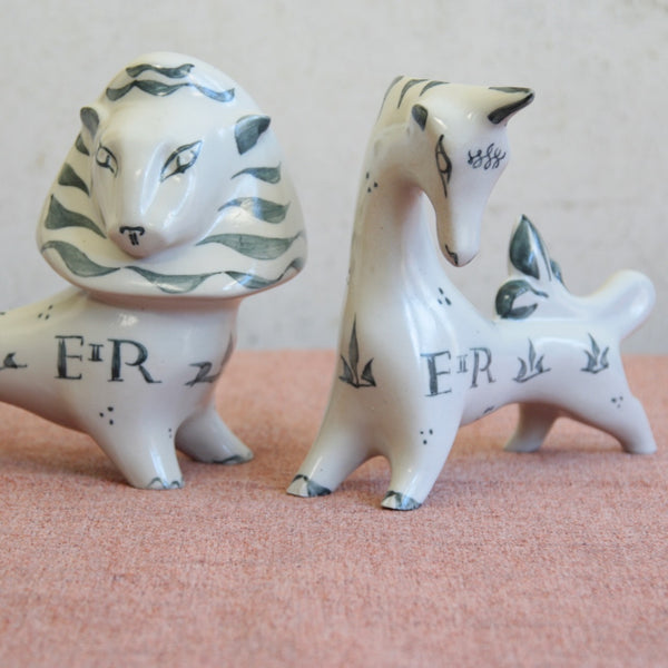 Close up of the heads of 1953 Coronation commemorative lion and unicorn by Susan Parkinson, elegant vintage British Modernism.