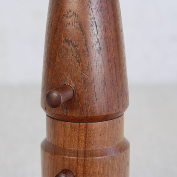 Close-up of a wooden Jens Quistgaard Dansk Designs salt and pepper mill with metal grinder, mid-century Scandinavian classic. For sale in the UK from Nordic design gallery Art & Utility.