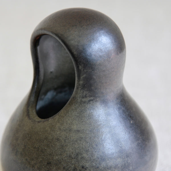 Finnish studio pottery vessel by Francesca Mascitti Lindh, combining biomorphic form with dark, patinated glazes inspired by antiquity.