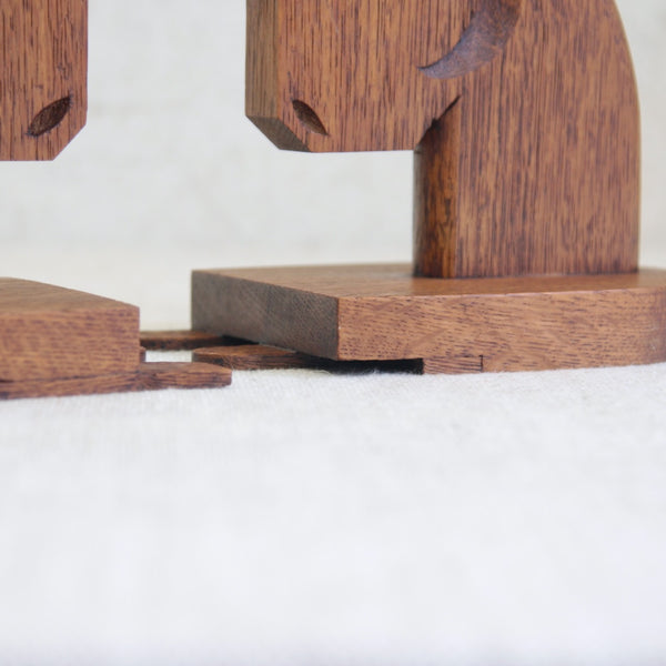 Vintage solid oak horse head bookends from England, featuring minimalist carved details and warm natural grain.