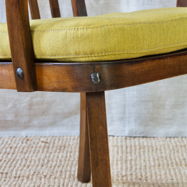 Detail of dark stained beech wood, 'Canada' armchair by Fritz Hansen, embodying the essence of Scandinavian design.