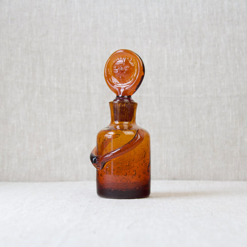 Modernist Swedish design by Erik Hoglund, an amber bubbly glass 'People' decanter
