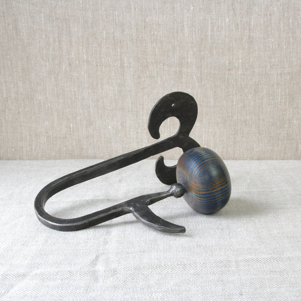 Modernist Swedish forged iron coat hook with pine ball designed by Erik Hoglund for Boda Smide, Brutalist design inspired by historical artefacts