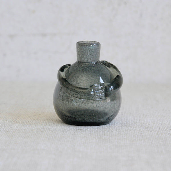 Head on shot of an early Boda glass vessel designed by Erik Höglund, demonstrating his first explorations of the human silhouette in blown glass.