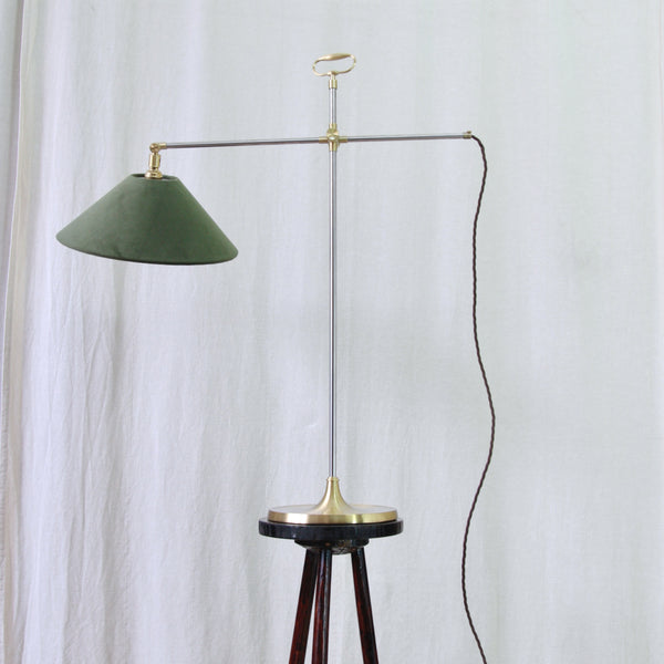 Adjustable Model 319 task light by Esben Klint for Le Klint, combining cool stainless steel with warm brass details.
