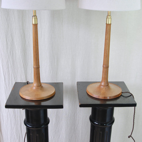 Vintage Danish Modern lighting by Esben Klint for Le Klint, a matching pair of tall Model 301/27 oak and brass table lamps.