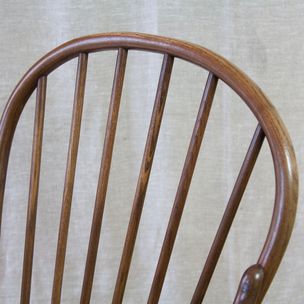A midcentury modern Windsor chair by Niels Eilersen, a Danish re-imagining of a vernacular English design that epitomizes Scandinavian design.