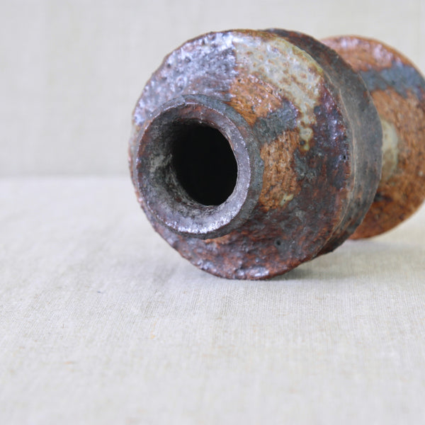 Architectural pottery vase by Annikki Hovisaari, its precisely constructed form contrasted by freely brushed and dripping glaze.