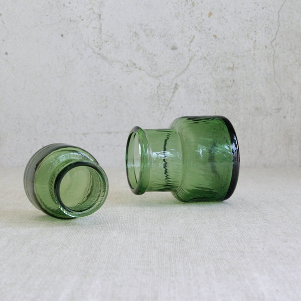 Mid-century Finnish glass vases by Nanny Still, Neptuna series, demonstrating the use of centuries-old dip mould techniques. Vase laying on their sides.