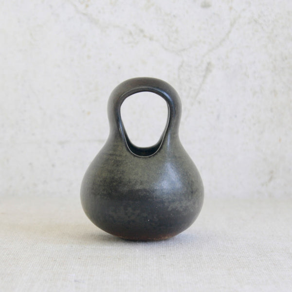 Head on shot of a rare Arabia studio ceramic by Francesca Mascitti Lindh, with a looped hood form suggesting ancient utilitarian vessels.