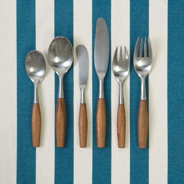 Image showing one of each of the six pieces of cutlery in this six person service. The design's model name is 'Fjord', it was created by Jens Quistgaard in 1953. For sale in UK from London based Scandinavian design gallery Art & Utility.