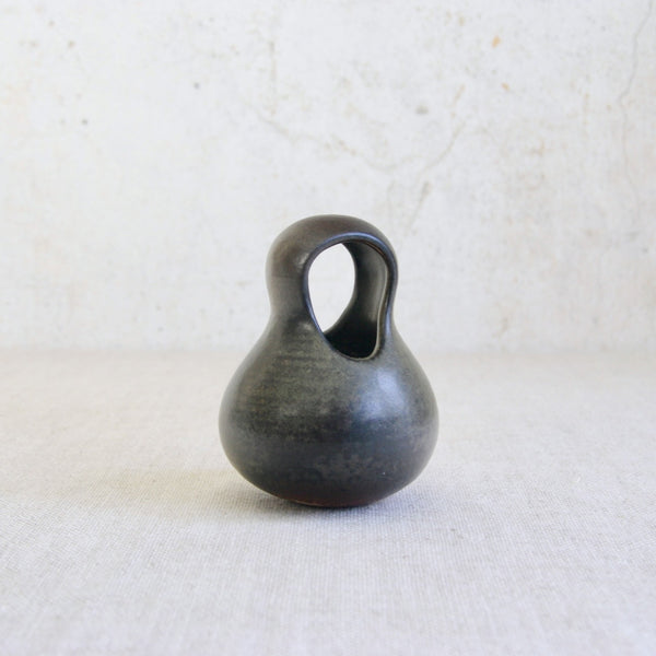 Hand-thrown biomorphic pot by Francesca Mascitti Lindh, retaining visible throwing lines and a richly mottled glaze surface.