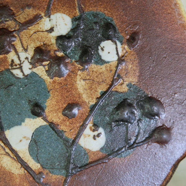 Close-up image of multi-clay decoration on Arabia dish by Francesca Mascetti-Lindh, 1960's Scandinavian ceramics. 