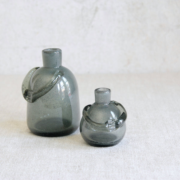 Pair of rare early examples of Erik Höglund’s People bottles, produced by Boda and notable for their use of Carborundum glass.