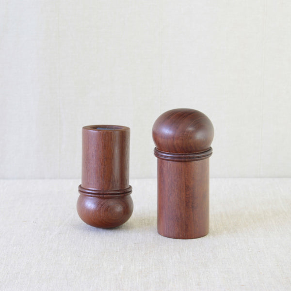 Mushroom-shaped pepper mill designed by Gunnar Cyrén for Dansk, turned from solid teak with a softly domed top.