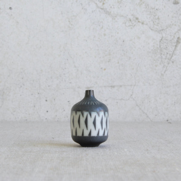 Gunnar Nylund miniature vase for Rörstrand featuring black and white geometric decoration