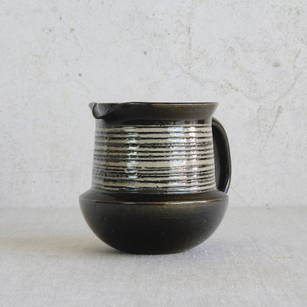Gustavsberg studio ceramic jug by Karin Björquist, handmade in Sweden and influenced by mid-century Scandinavian design principles.
