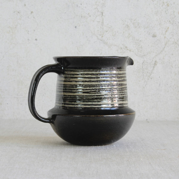 Sculptural stoneware jug by Karin Björquist, produced at Gustavsberg, Sweden, reflecting the organic Modern aesthetic of the 1960s.