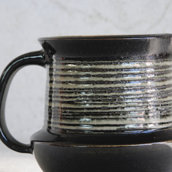 Detail of textured surface of rare Scandinavian studio jug by Karin Björquist, handmade at Gustavsberg and influenced by Nordic Modern design traditions.