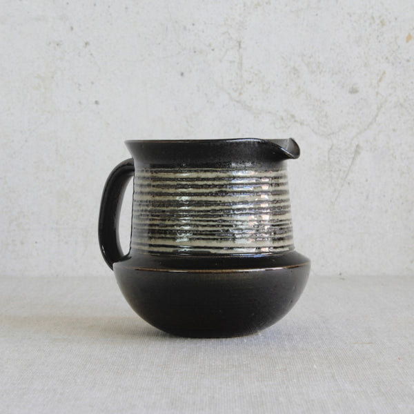 Hand-thrown ceramic jug by Karin Björquist from the Gustavsberg studio, Sweden, showcasing mid-century Scandinavian Modernism and organic form.