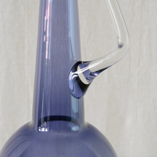 Tamara Aladin model 1749 carafe in attractive lilac glass, with a bold geometric form and hand-applied triangular handle.