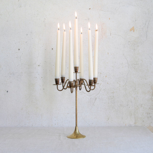 Mid-century Swedish seven-branch brass candelabra, 1950s. A Nordic design blending classical inspiration with modern simplicity.