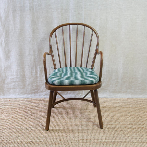 Collect a piece of Scandinavian design history with a Niels Eilersen Windsor chair from the mid-20th century.