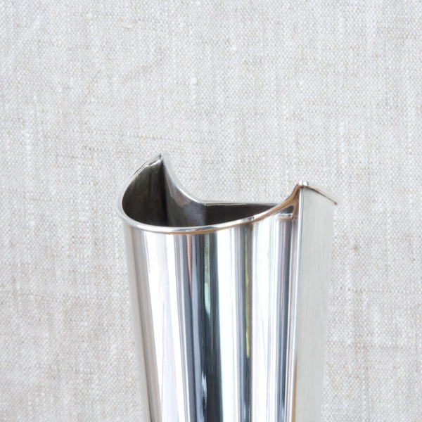 Detail of the top half of a Tapio Wirkkala silver vase. Wirkkala worked in silver from the early 1950's, designing jewellery alongside drinking vessels and trays, as well as vases.