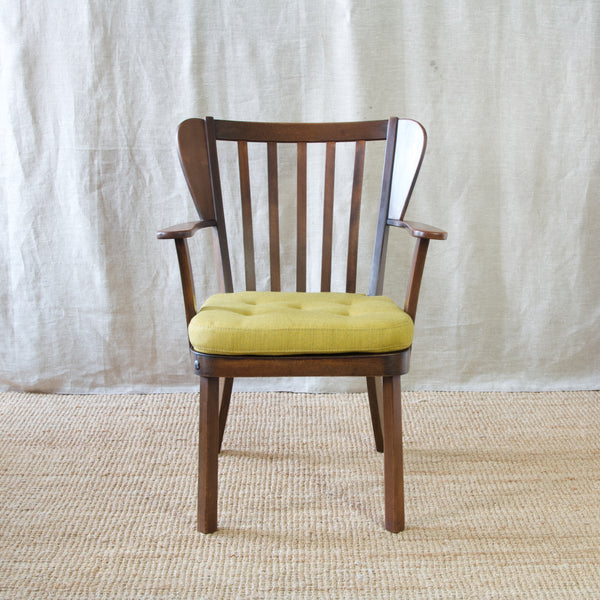 Christian E. Hansen's 'Canada' armchair, an early Fritz Hansen design that exudes timeless elegance and charm.