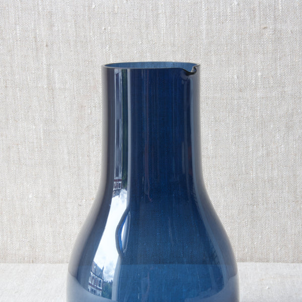 A model 1615 Kaj Franck carafe or pitcher. A cylindrical shape is deployed in the neck of the carafe so a solid grip my be secured.